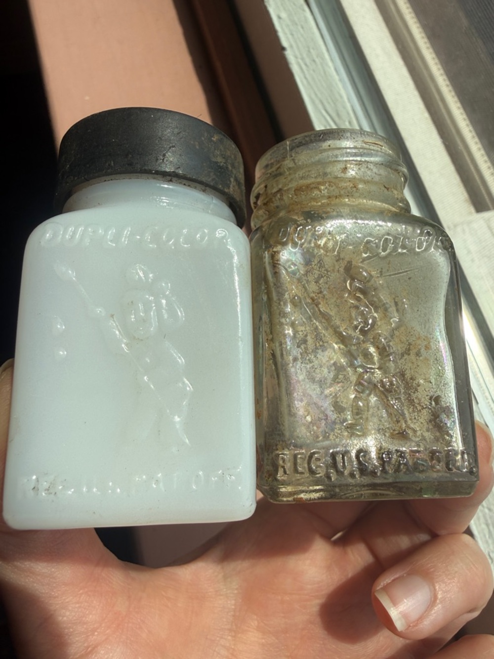 Milk glass embossed dupli-color with figure holding spear & clear bottle antique